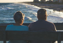 Being Offered Retiree or Labor Group Medicare Coverage? Proceed with Caution. Couple in retirement on pier